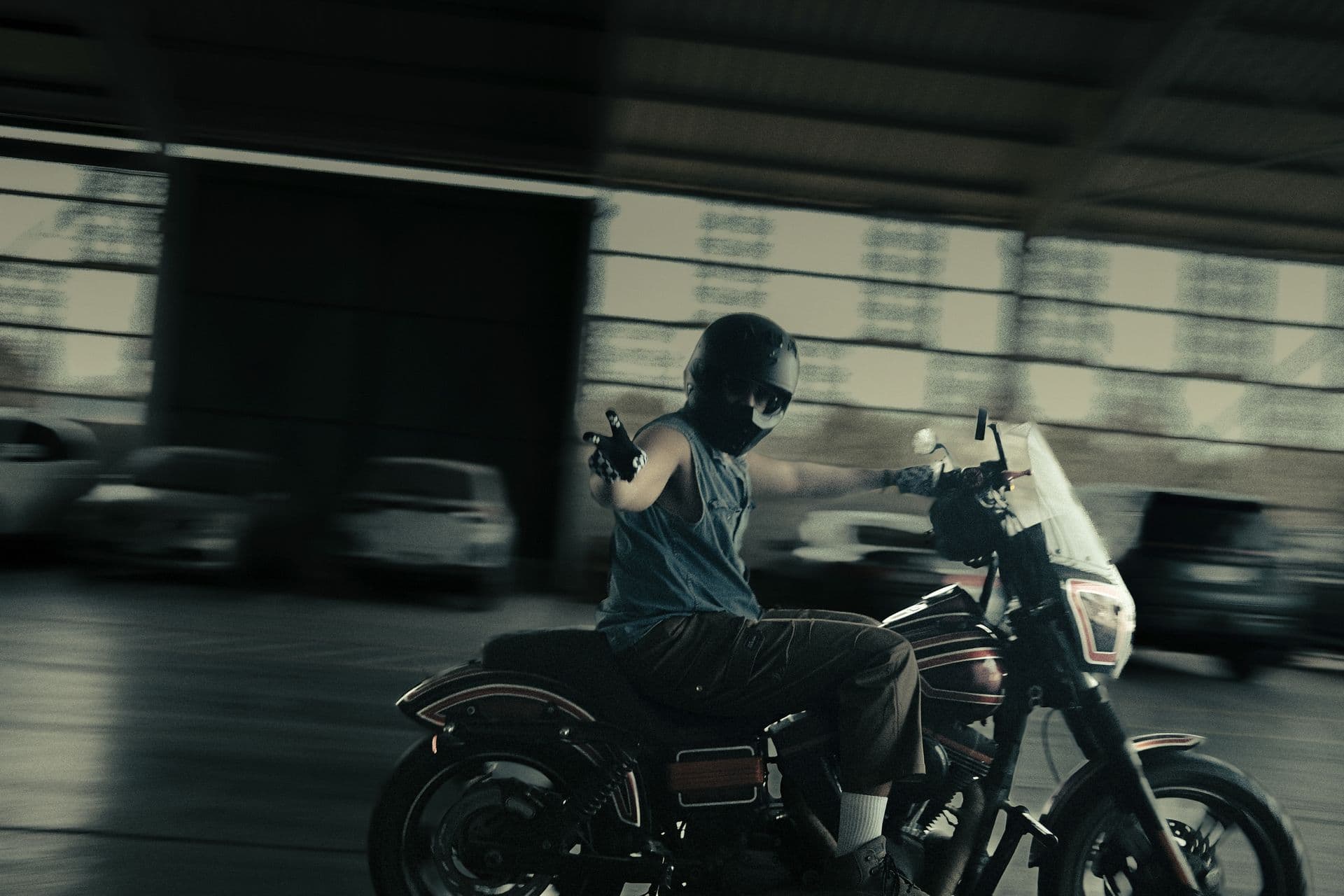A rider passing at speed, the background blurred
